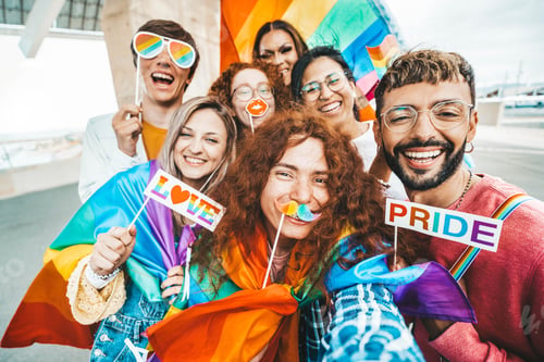 Preview: Diverse group of cheerful young people celebrating gay pride day
