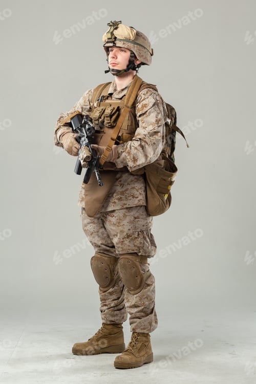 Preview: Soldier stands with rifle in military gear and uniform during training session