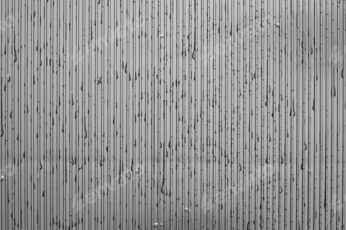 Preview: Drops Of Water Are Located On The Textured Corrugated Surface Of A Plastic Plate Of Gray Color