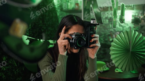 Preview: Girl takes pictures with camera in a party