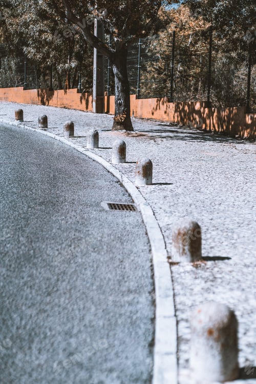 Preview: An asphalt road with small poles