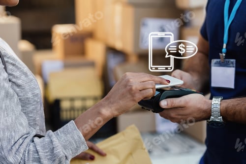 Preview: Unrecognizable woman making contactless payment with smart phone to a delivery man.