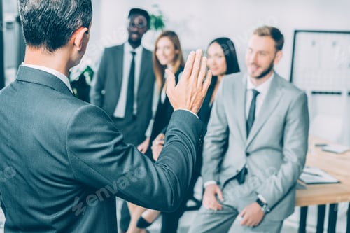 Preview: multiracial businesspeople having conversation in conference hall