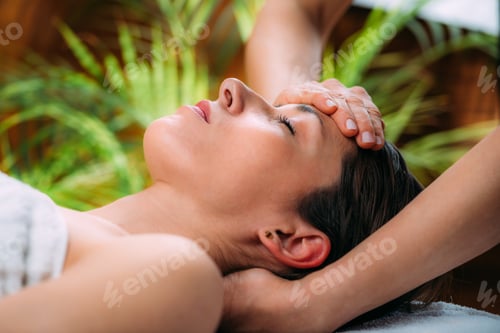 Preview: Craniosacral Therapy Massage. Therapist Massaging Woman’s Forehead.