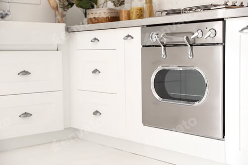 Preview: New modern oven in stylish kitchen. Cooking appliance