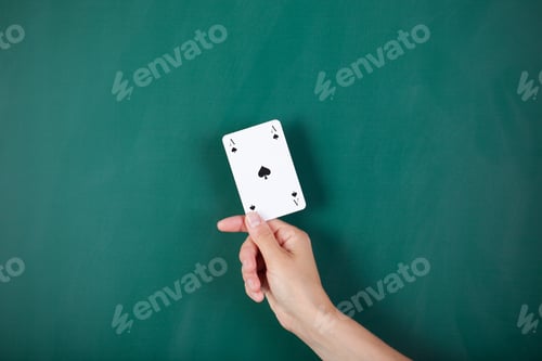 Preview: Closeup Of Woman'S Hand Holding Ace Card Against Green Board