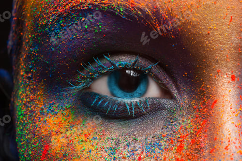 Preview: Eye of model with colorful art make-up, close-up
