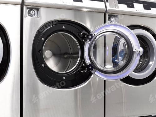 Preview: Industrial washing machines in a public laundromat