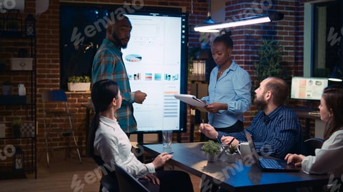 Preview: African american employees presenting company revenue statistics visualization