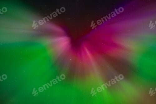Preview: Vibrant aurora borealis with green and purple hues.