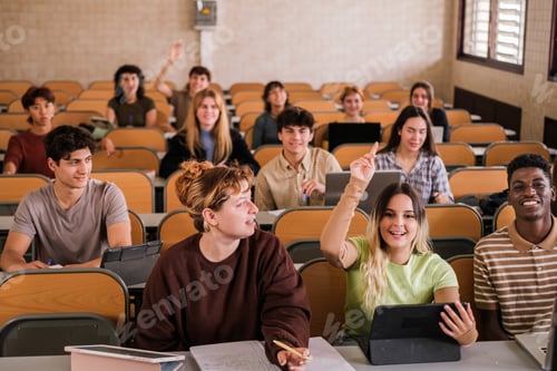Preview: Group of college students raising their hands to ask the teacher during class