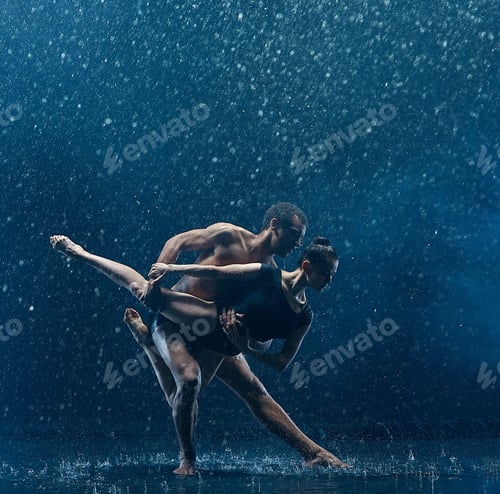 Preview: Young couple of ballet dancers dancing unde rwater drops