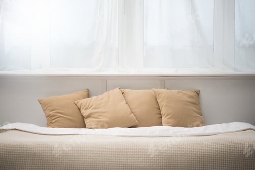 Preview: bedroom with brown pillows and white blanket on empty bed