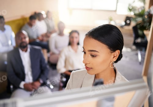 Preview: Cropped shot of an attractive young businesswoman giving a presentation in the boardroom