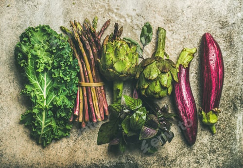 Preview: Flat-lay of fresh green and purple vegetables, top view