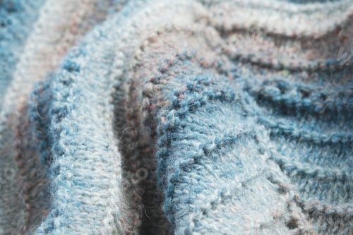Preview: Knitted background. Knitted fabric texture, pure sheep wool, color gradient.