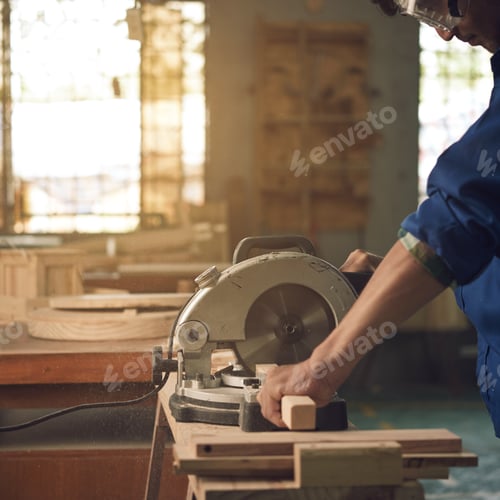 Woodworker Using Circular Saw in Brightly Lit Workshop