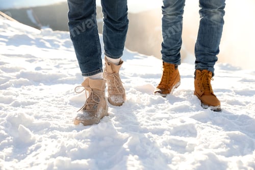 Preview: Couple walking on sunny winter day after snow storm