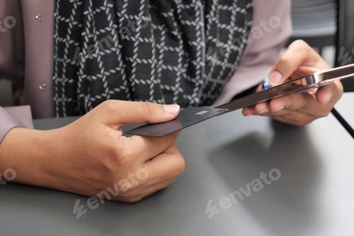 Preview: women hand holding credit card and using smart phone shopping online
