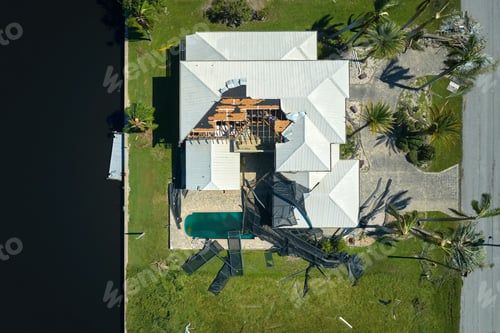 Preview: Hurricane Ian destroyed house in Florida residential area. Natural disaster and its consequences