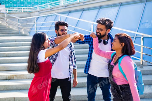 Preview: indian students keeping distance and do home work outdoors