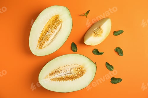 Preview: Flat lay composition with melon and mint leaves on color background