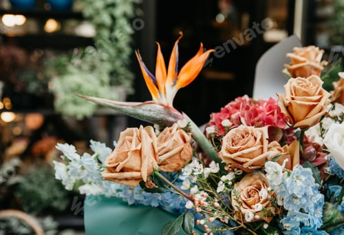 Preview: Beautiful boho bouquet of different color plants and cream roses in flower shop