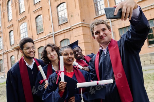 Preview: Graduated student making photo with his friends