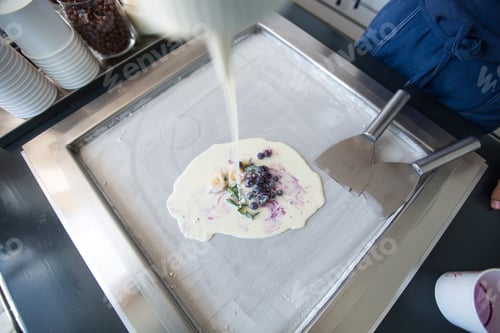 Preview: Stir-fried ice cream rolls at freeze pan. Rolled ice cream, hand made ice cream dessert. Fried ice