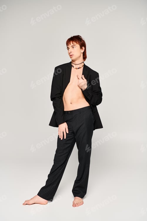 Preview: Elegance captured: suited man strikes a pose