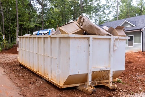 Preview: A rubbish removal container on of a house underneath an industrial building is used for waste