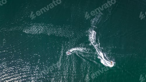 Preview: Aerial view of man riding jet ski on Baltic sea.