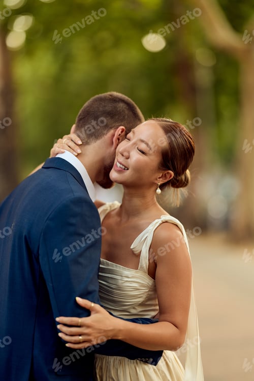 Preview: Couple Embracing During Romantic Wedding Day in Outdoor Natural Setting