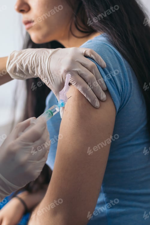 Preview: nurse giving a vaccine to a patient. Close-up