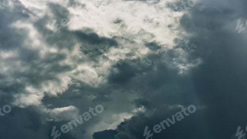 Preview: Dramatic clouds on dark stormy sky. Heaven background. Epic cloudscape, thunderstorm backdrop