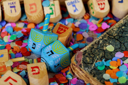 Preview: Dreidels for Hanukkah on wooden table wooden dreidel spinning