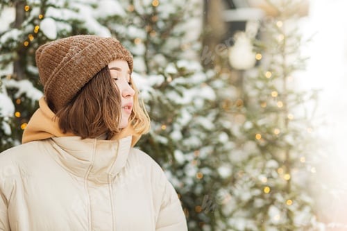 Preview: Teen age girl walking in street decorated in Christmas spirit