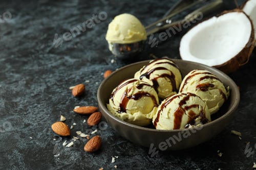 Preview: Bowl with ice cream balls and ingredients on black smokey table