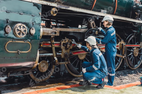 Preview: Train engineer team working service maintenance old dirty vintage classic steam engine locomotive