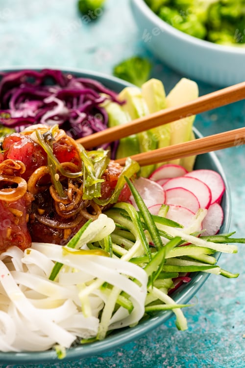 Preview: Colorful Bowl with Raw Tuna Fish, Rice Noodles and Variety of Fresh Vegetables