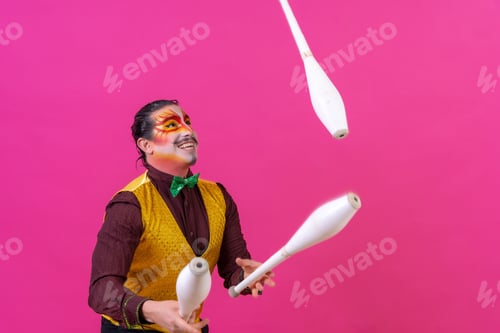 Preview: Cheerful circus performer skillfully juggling a number of clubs isolated on pink background