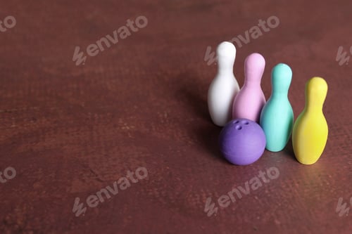 Preview: Selective focus image of bowling ball and colorful bowling pins