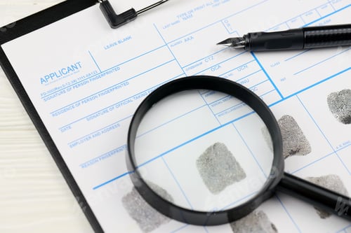 Preview: Fingerprints card police form on A4 tablet lies on office table with pen and magnifying glass