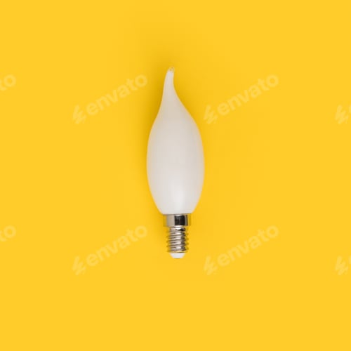 Preview: close up view of white light bulb isolated on yellow