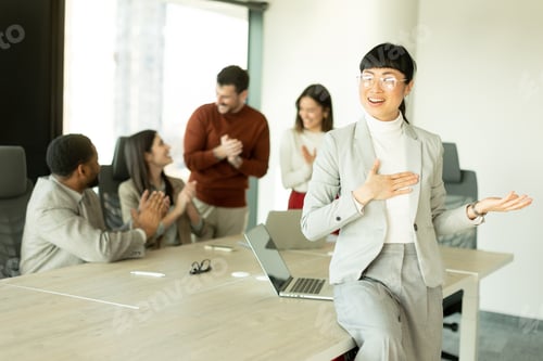 Preview: Business professionals collaborate in a modern office setting during a productive meeting session