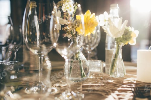 Preview: Wineglasses, bottle of water. Wedding banquet at sunset