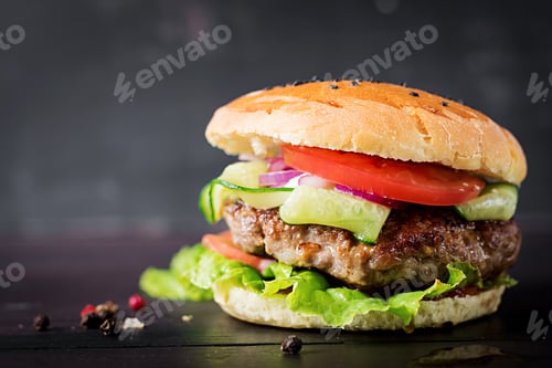 Preview: Big sandwich - hamburger burger with beef, tomato, red onion and lettuce.