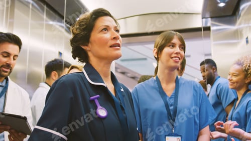 Preview: Medical Team Standing In Lift Inside Modern Hospital Building