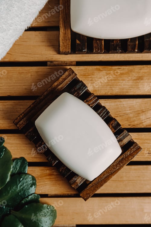 Preview: A top view hard soap over a soap dish with relaxing spa style with a towel and plants