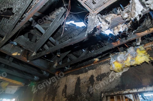 Preview: Burned house interior after fire burnt wooden poles walls